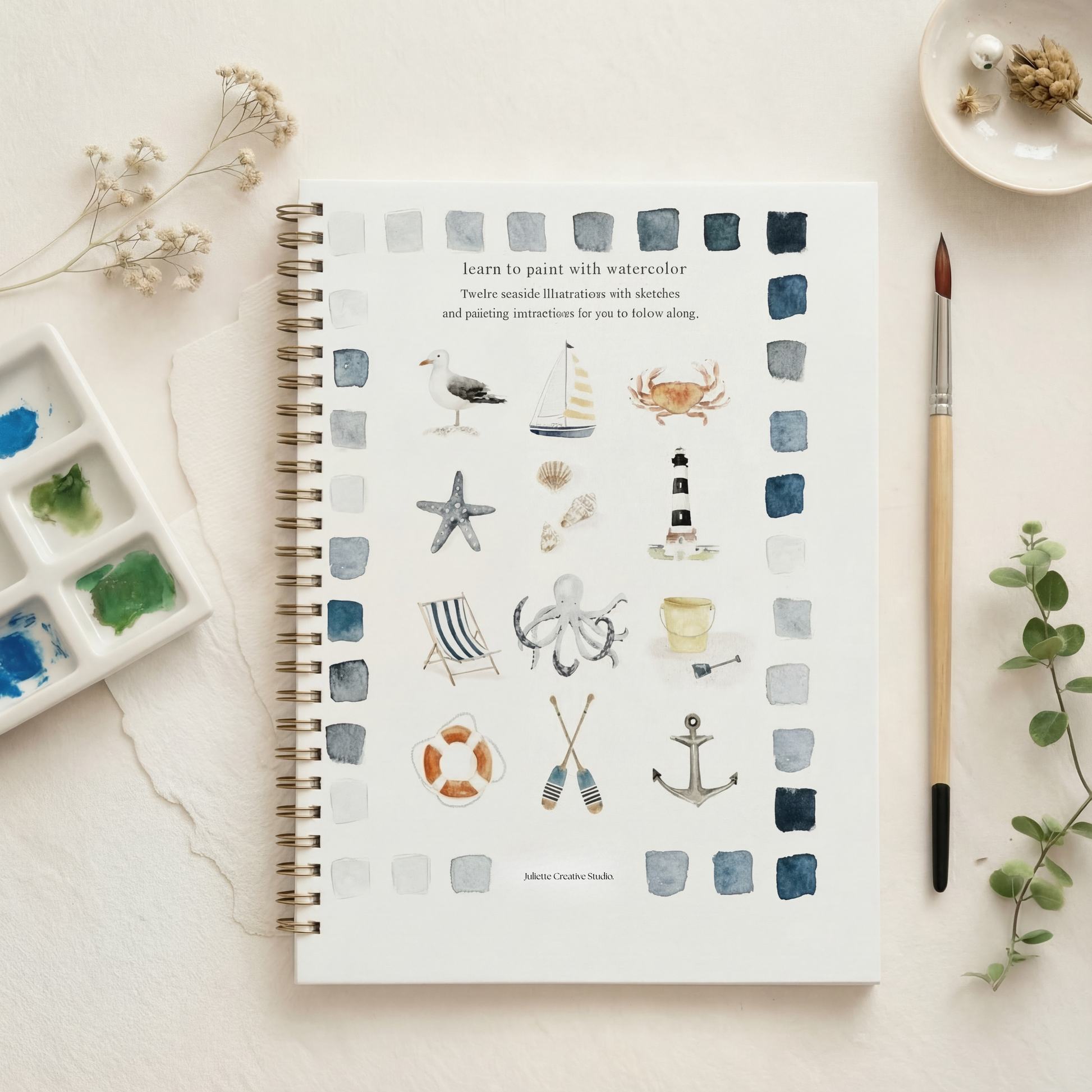 Dos du carnet d’aquarelle Seaside avec motifs marins et palette de peinture